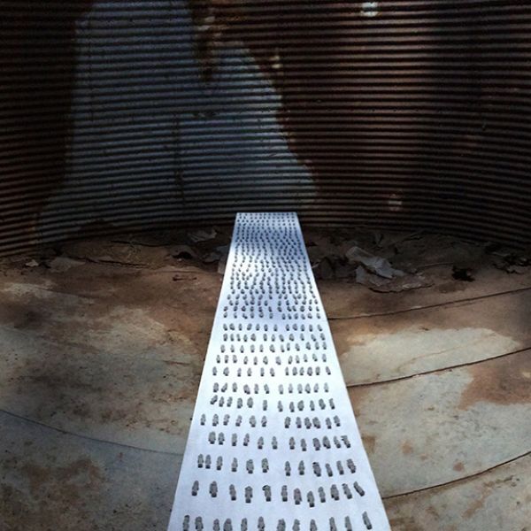A row of numbers are on a metal surface