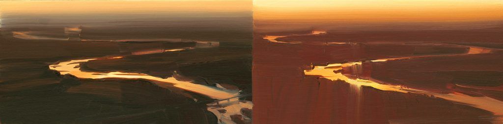 An aerial view of a city at sunset.