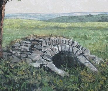 Stone archway in a grassy field with a tree and rolling hills in the background.
