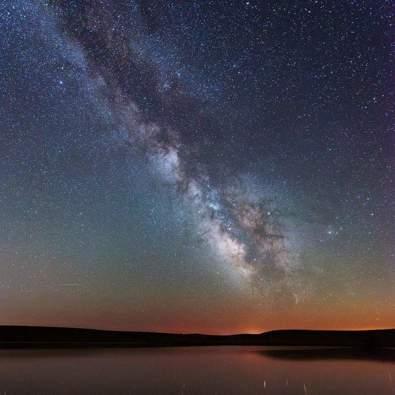 A crescent moon in a starry night sky