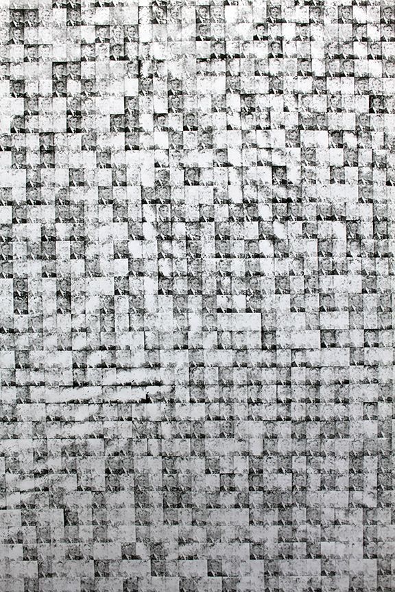 A close up of a black and white checkered pattern on a wall.