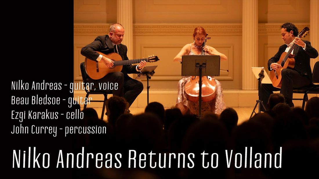 Concert featuring a guitarist, cellist, and guitarist with audience in a hall.