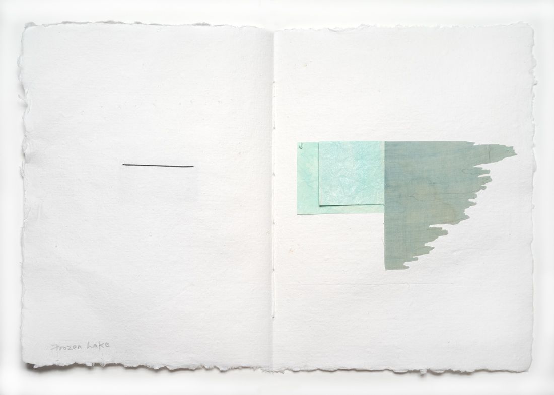 A white piece of paper with a green square on it