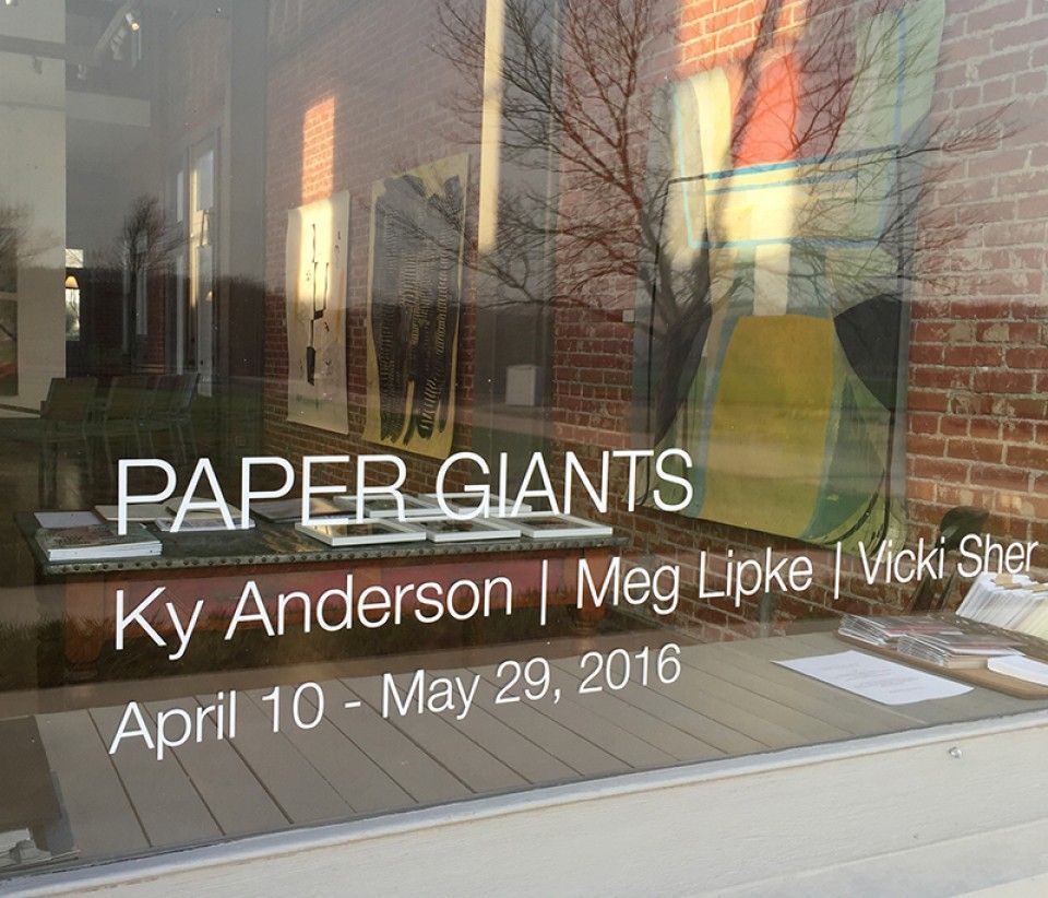A window with the words paper giants on it
