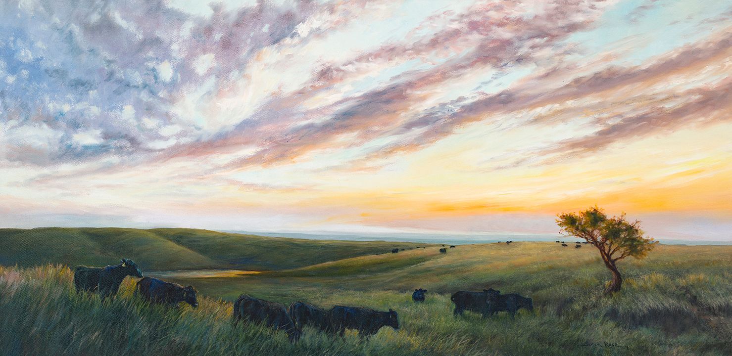Pastel landscape of a green field with black cows grazing at sunset.