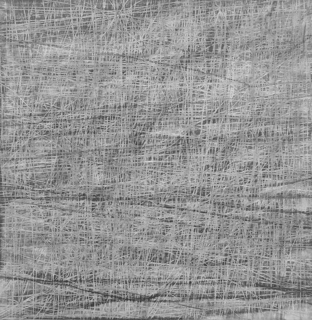It is a black and white photo of a wooden surface.