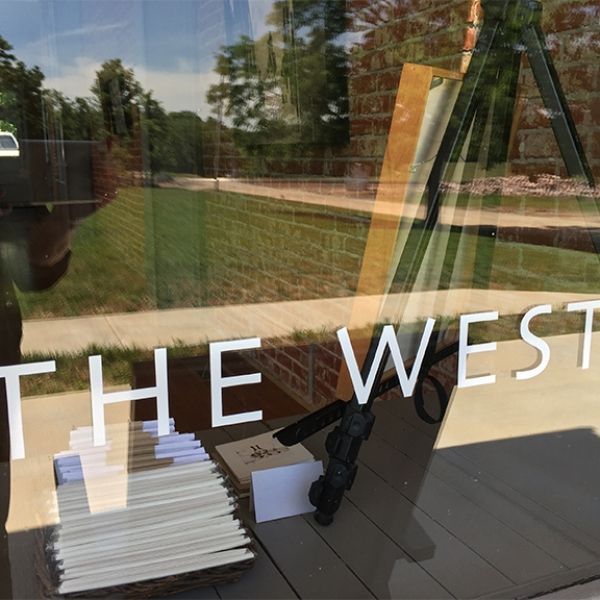 A window with the word west on it
