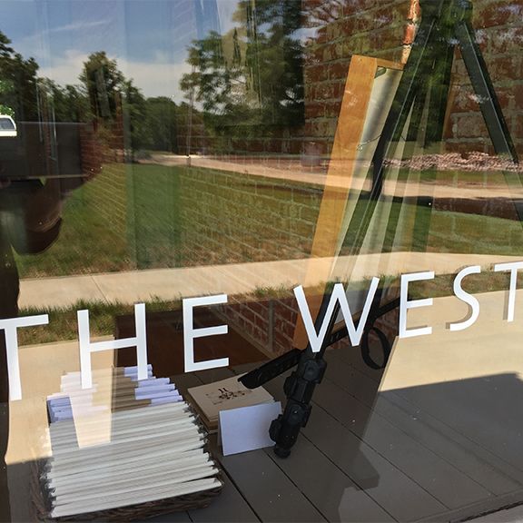A window with the word west on it