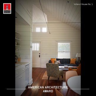 A living room with a couch and chairs and a sign that says american architecture award