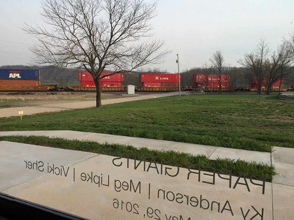 A view of a train yard with a sign that says apl on it