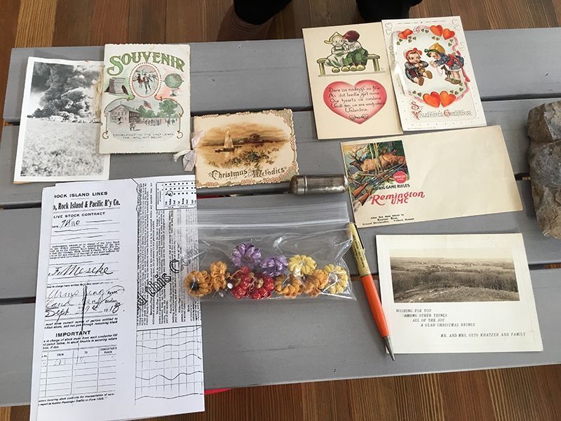 A bunch of cards on a table including one that says souvenir