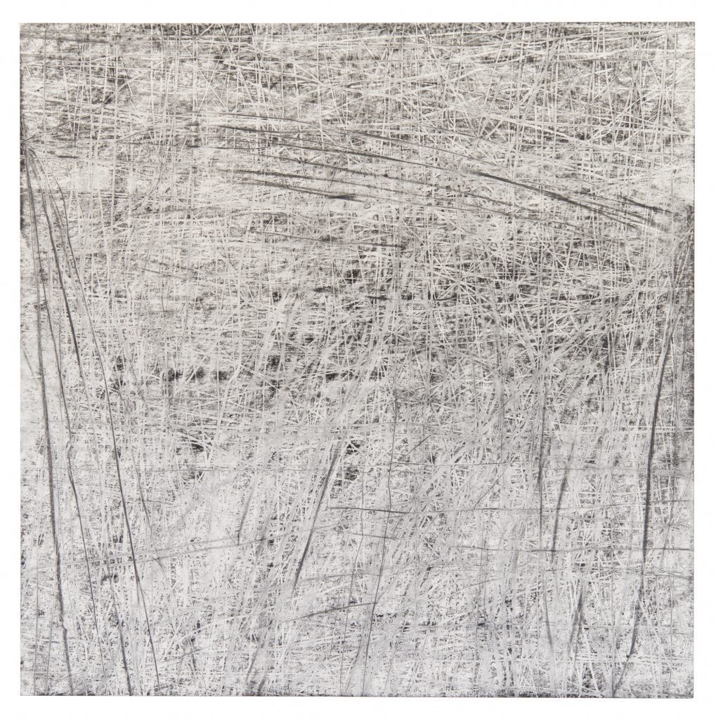 A close up of a scratched wooden surface.