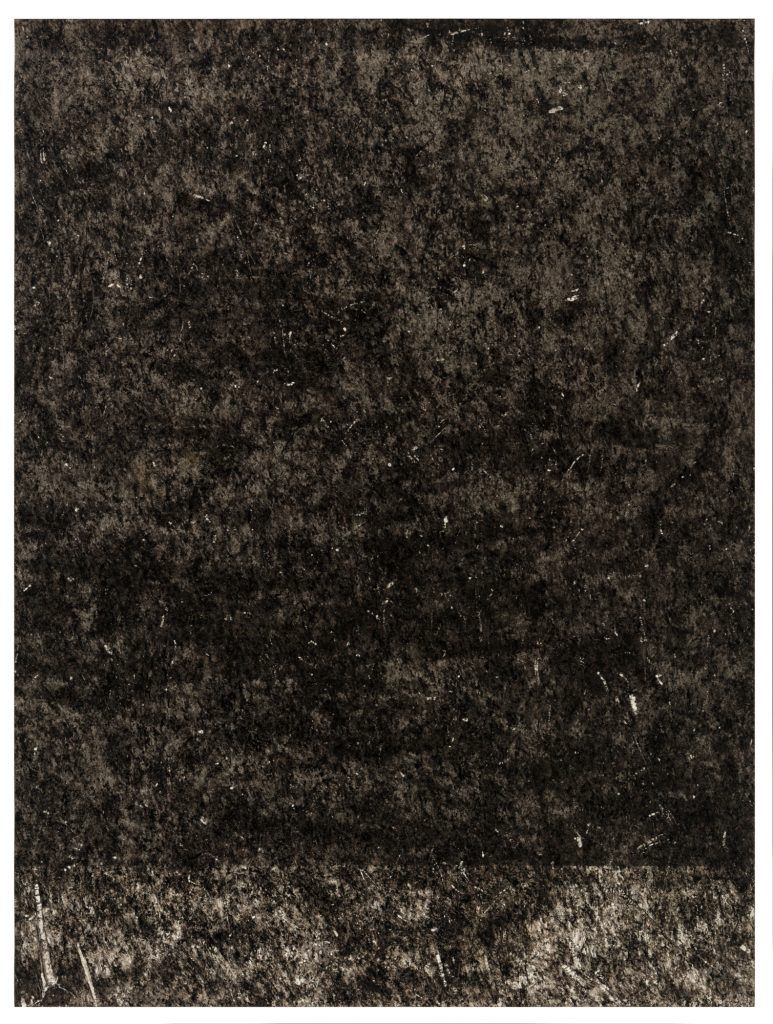 A black and white photo of a carpet texture.