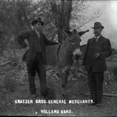 Two men with a donkey;