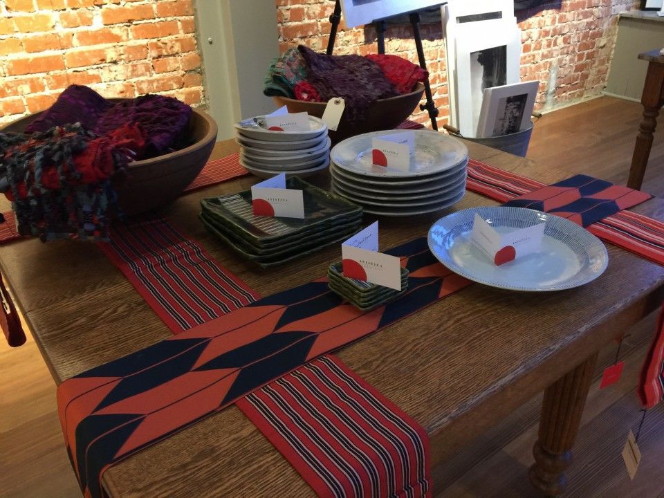 A table with plates and place cards on it