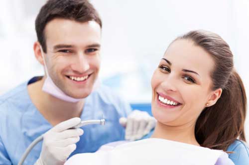 Cosmetic Dentistry — Dentist and Woman Smiling in Forest Hills, NY