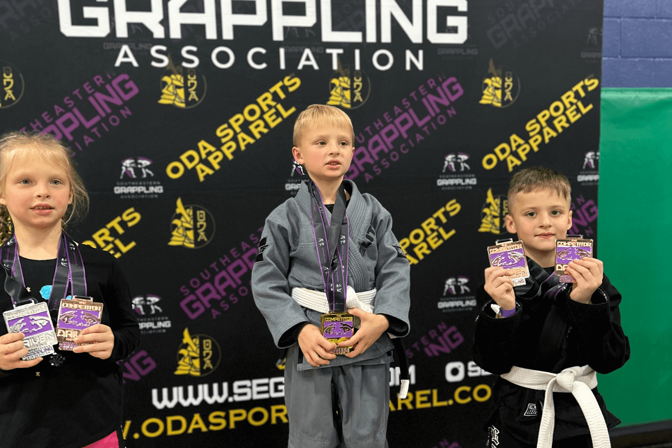 Adults practicing Jiu-Jitsu drills at Speakeasy Jiu-Jitsu & Wrestling Academy in Asheville, NC for stress relief.