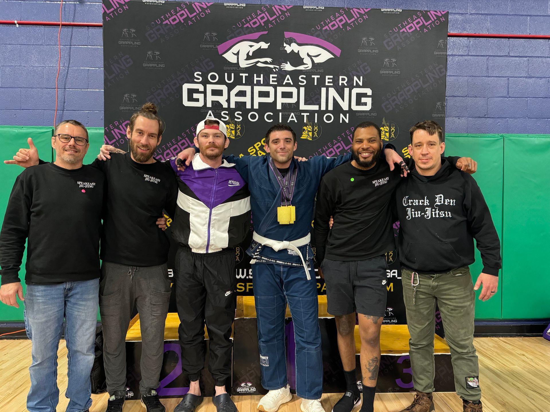 Adults practicing controlled grappling at Speakeasy Jiu-Jitsu & Wrestling Academy in Asheville, NC to build focus.