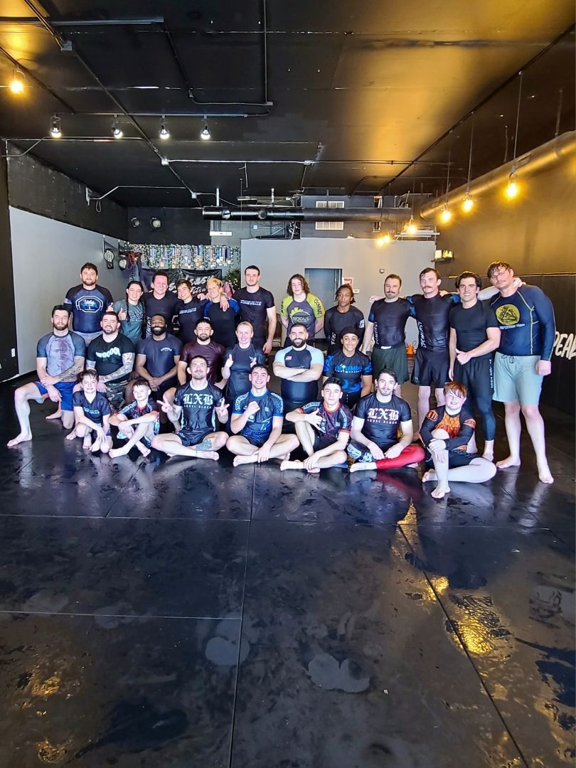 Adults drilling Jiu-Jitsu techniques at Speakeasy Jiu-Jitsu & Wrestling Academy in Asheville, NC for fitness and focus