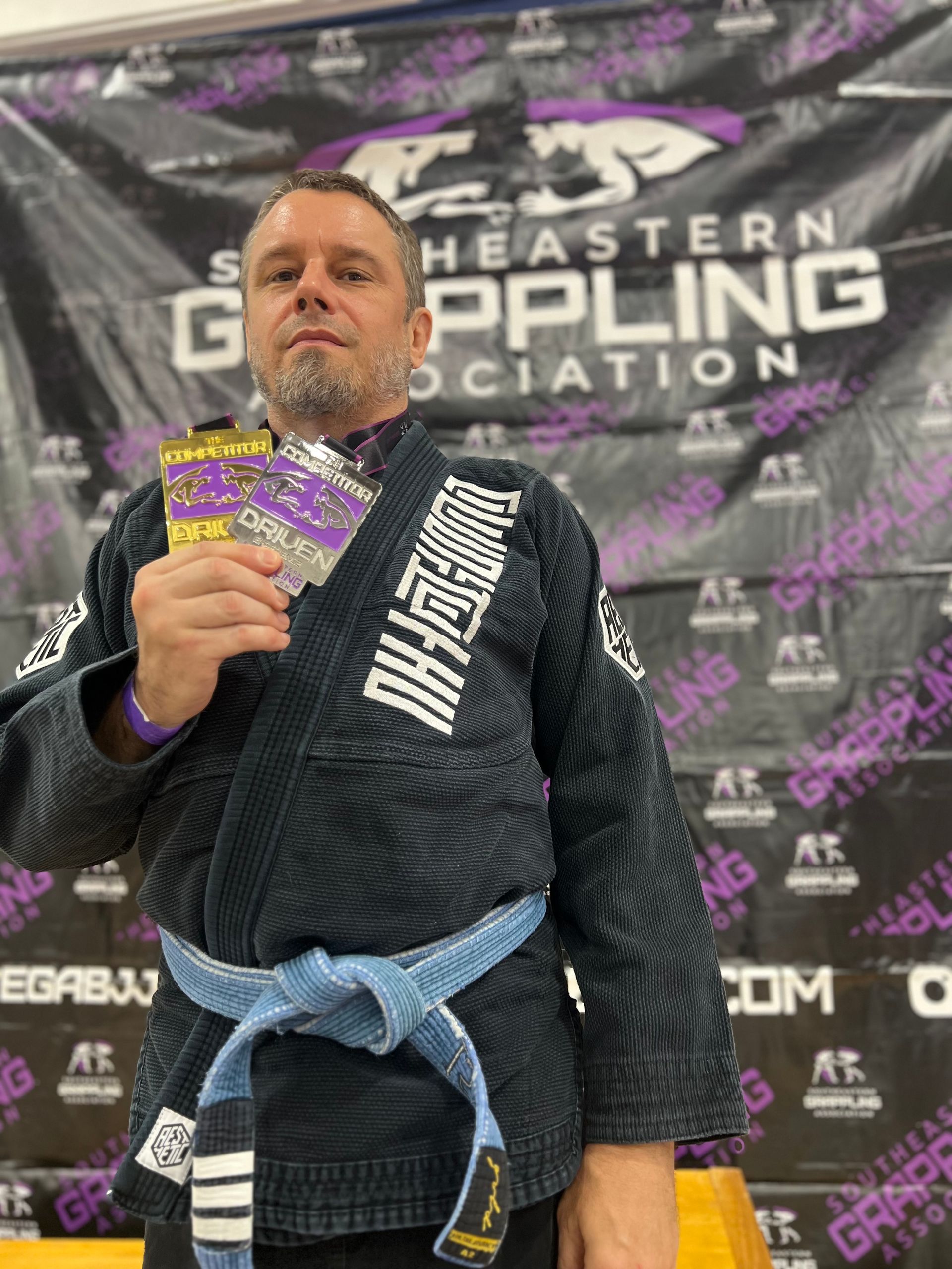 Adults training Jiu-Jitsu at Speakeasy Jiu-Jitsu & Wrestling Academy in Asheville, NC, building calm confidence.