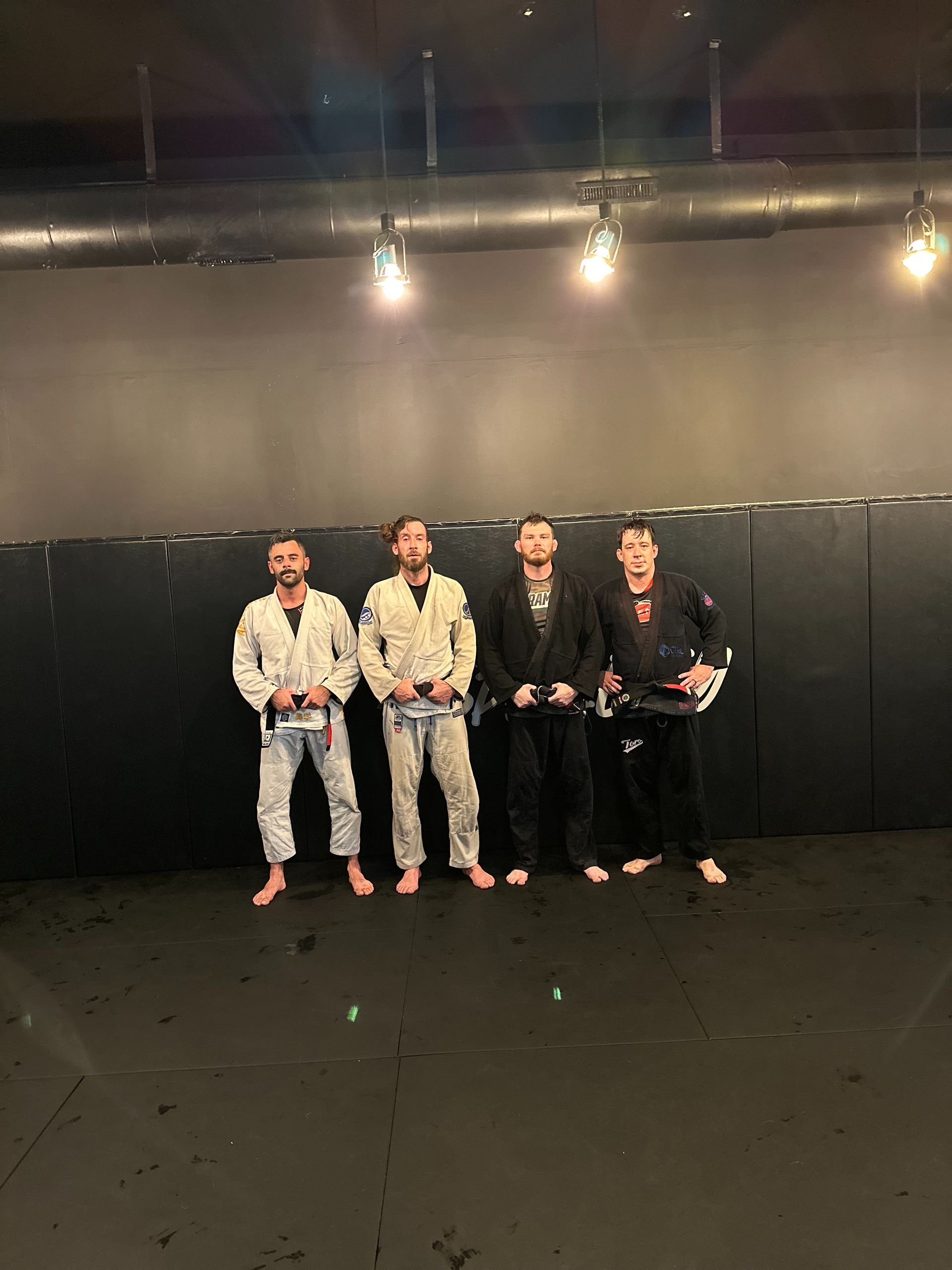 Students drilling Jiu-Jitsu technique at Speakeasy Jiu-Jitsu & Wrestling Academy in Asheville, NC to build real confidence.