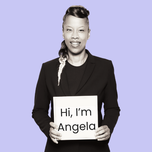 Angela Scarlett, our Principle Lawyer is holding a sign that reads