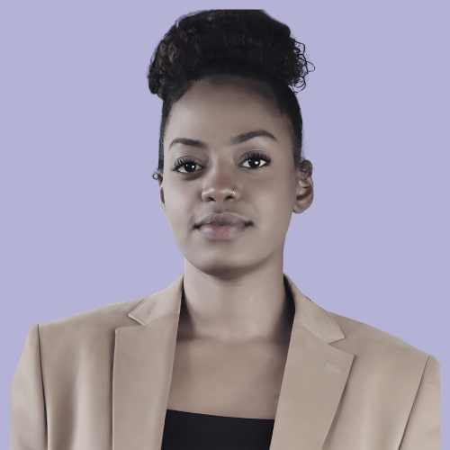 Sarra Ali in a tan blazer and black top; bun hairstyle; light purple background.