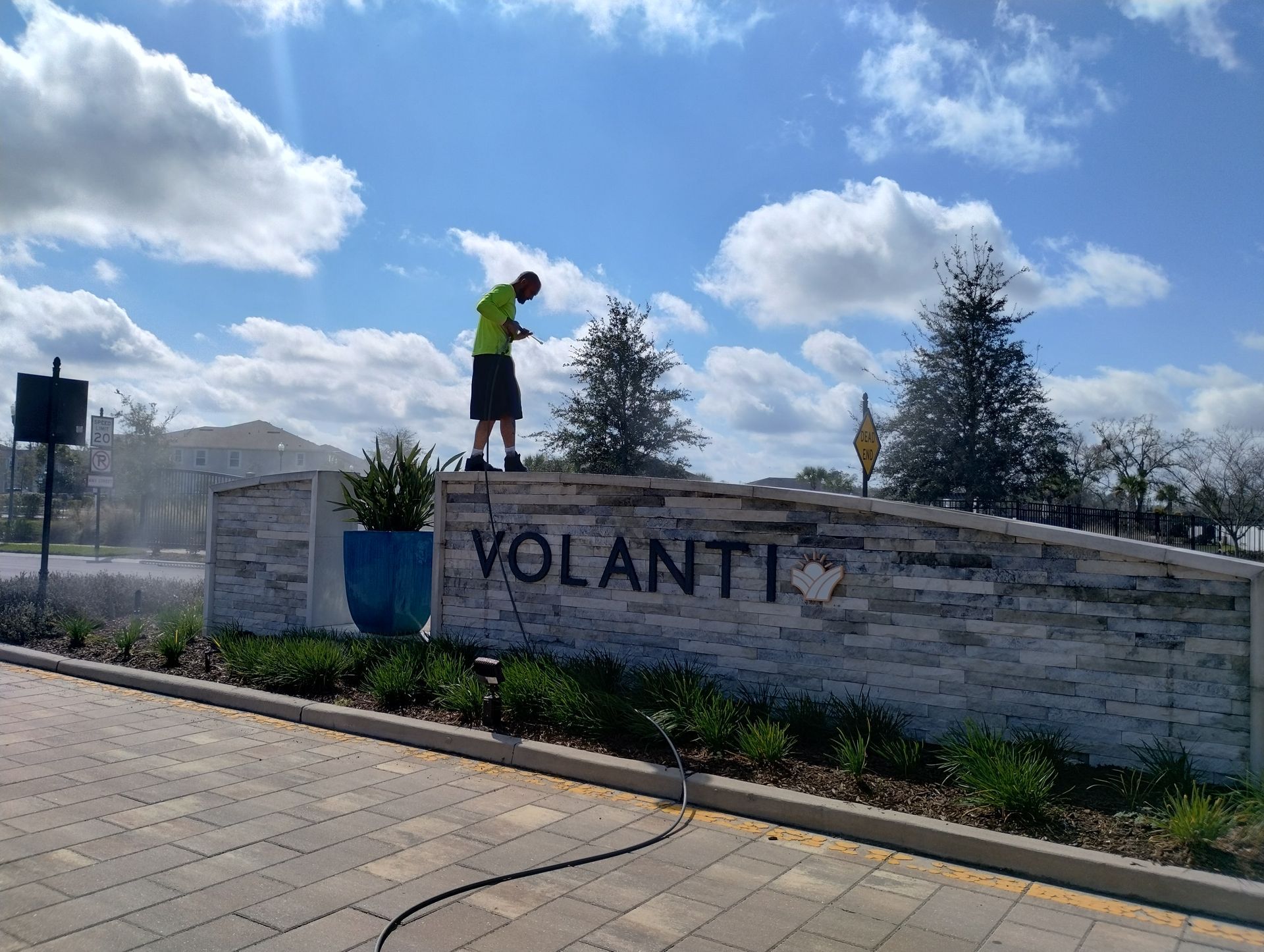 Man pressure washing the 