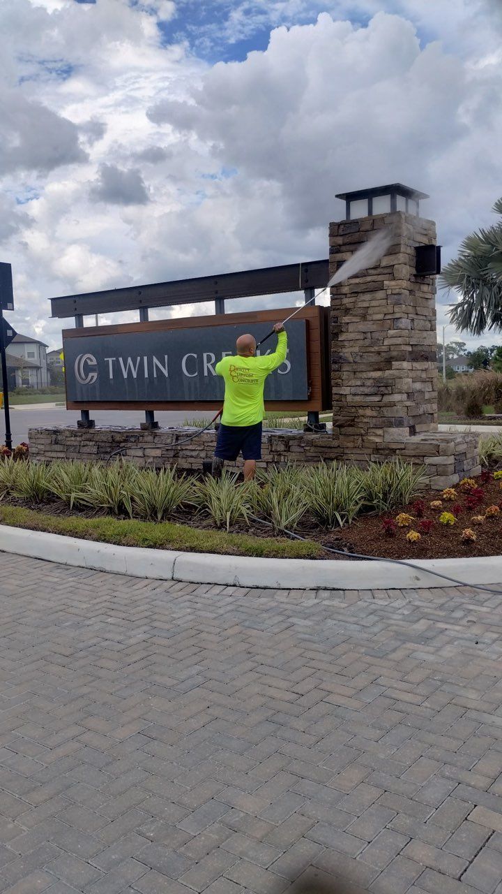 Man in neon shirt cleaning the