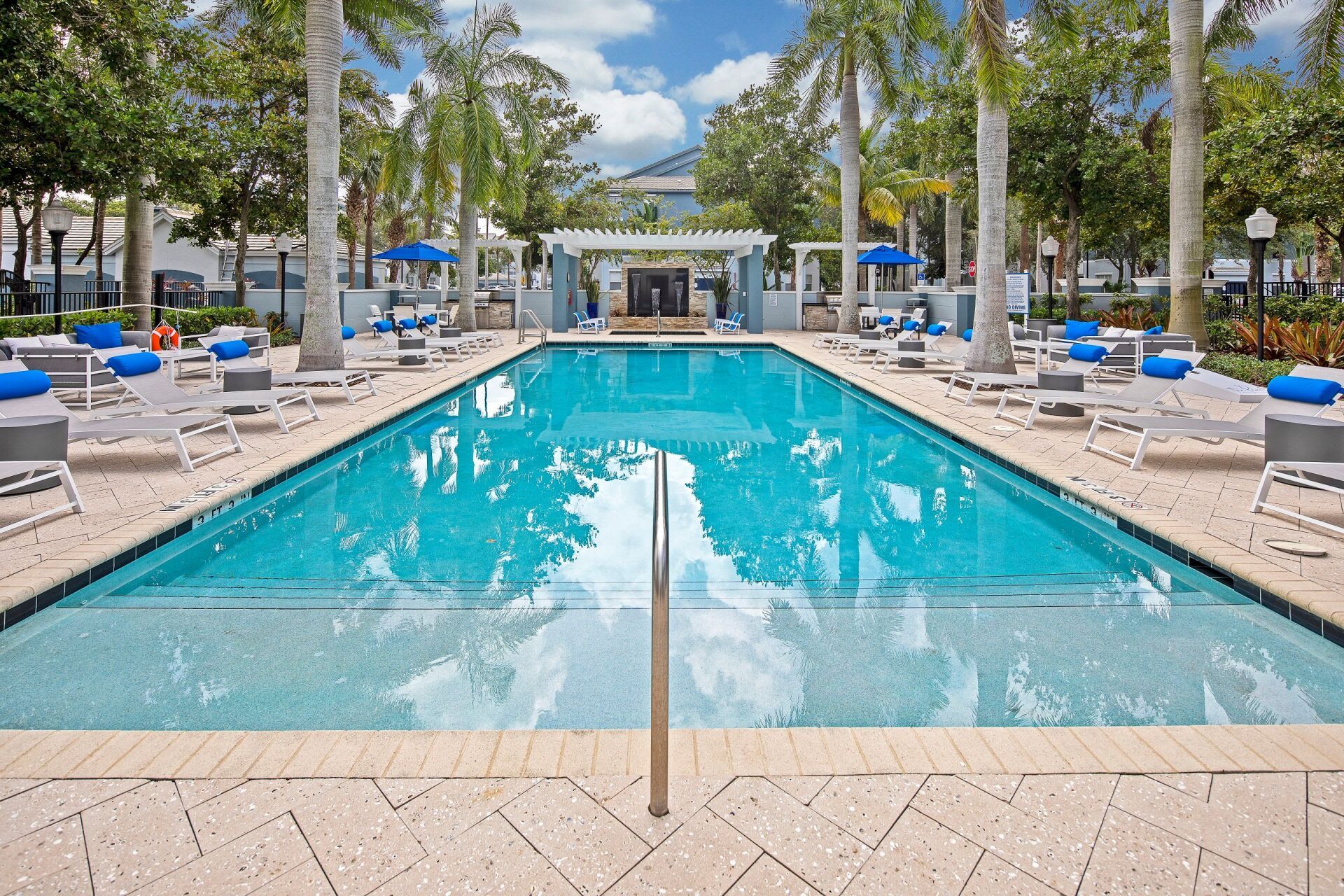 Outdoor Pool and Chairs  | The Pearl