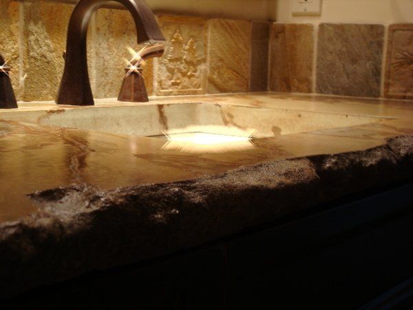A bathroom sink with a faucet and starfish handles