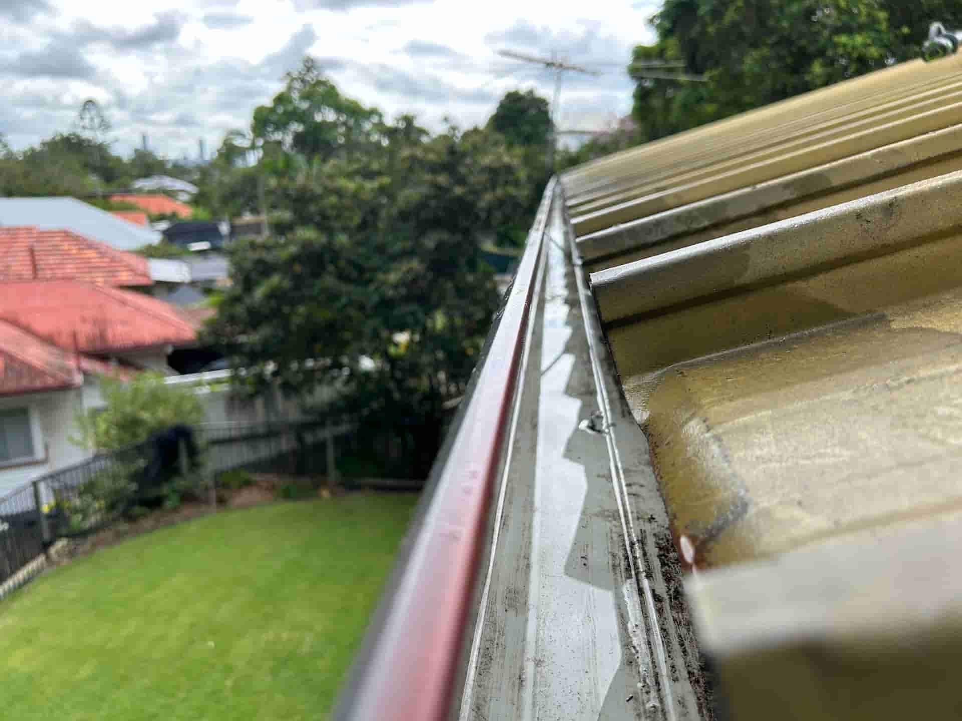 A Close Up Of A Gutter On The Side Of A Building — Pristine and Co In Coomera, QLD