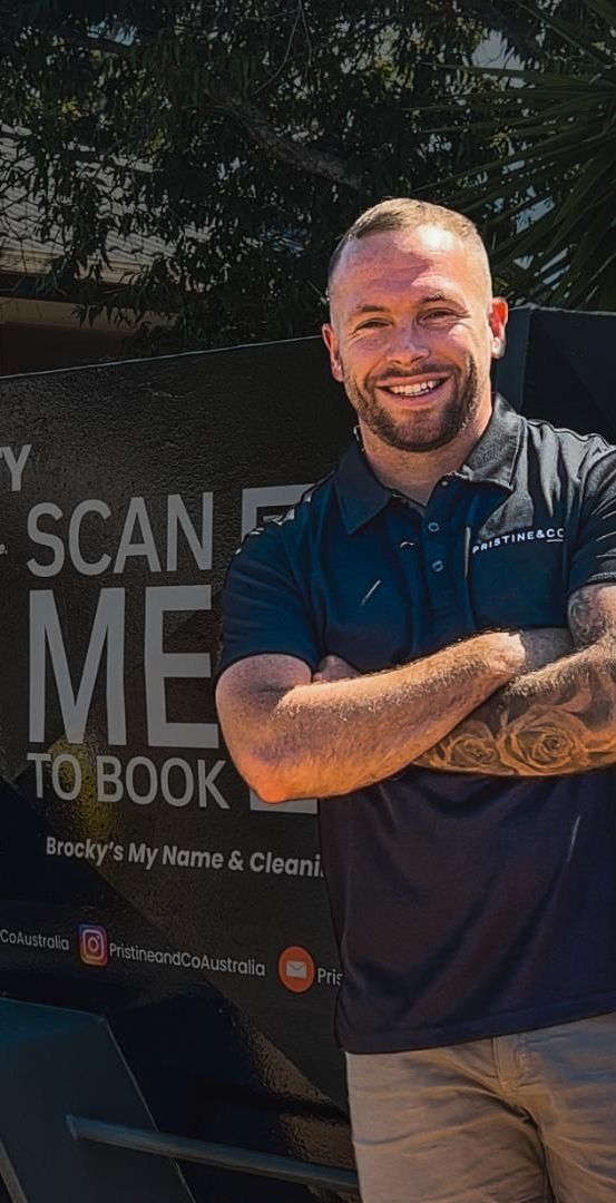 A Man Is Standing In Front Of A Trailer — Pristine and Co In Coomera, QLD