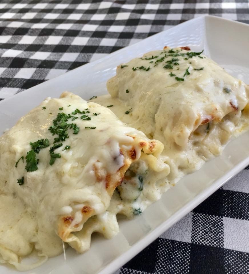 lasagna with sauce topped with herbs