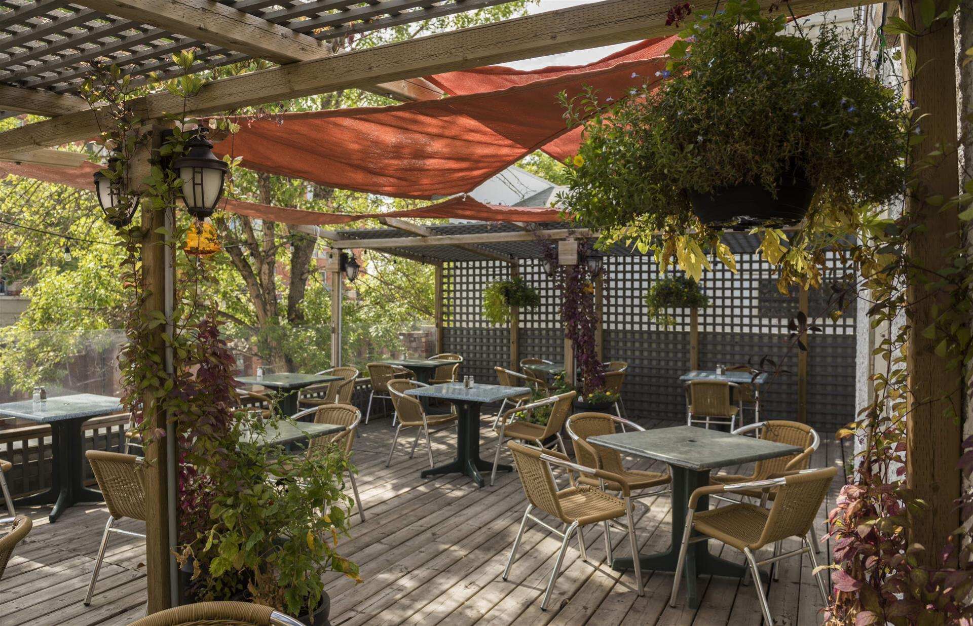 empty outdoor patio showcasing tables and chairs