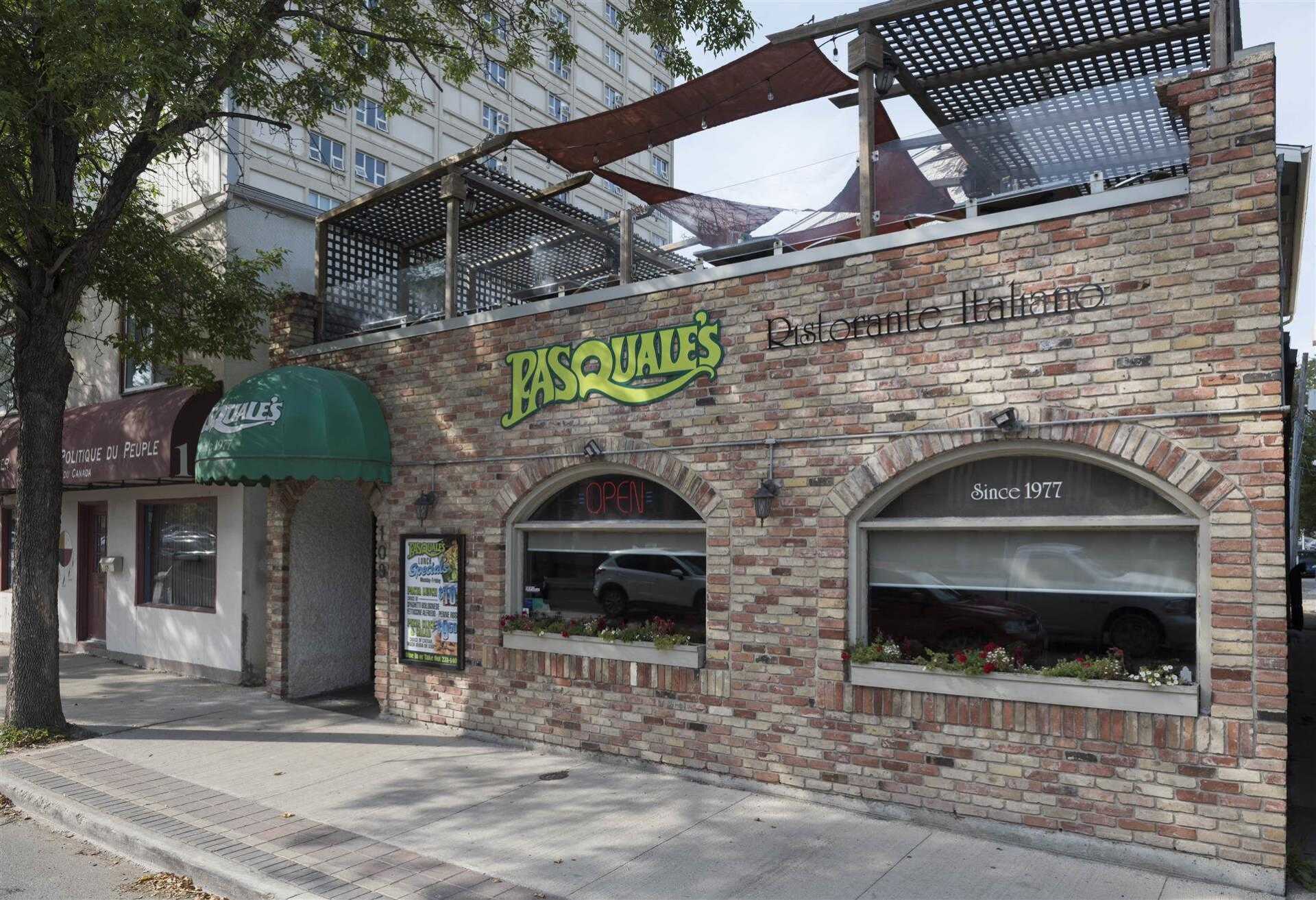 exterior side of pasquale's showcasing the second story eating area
