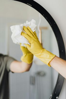 wiping mirror with towel