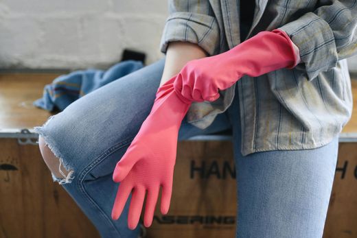 Cleaner putting on gloves