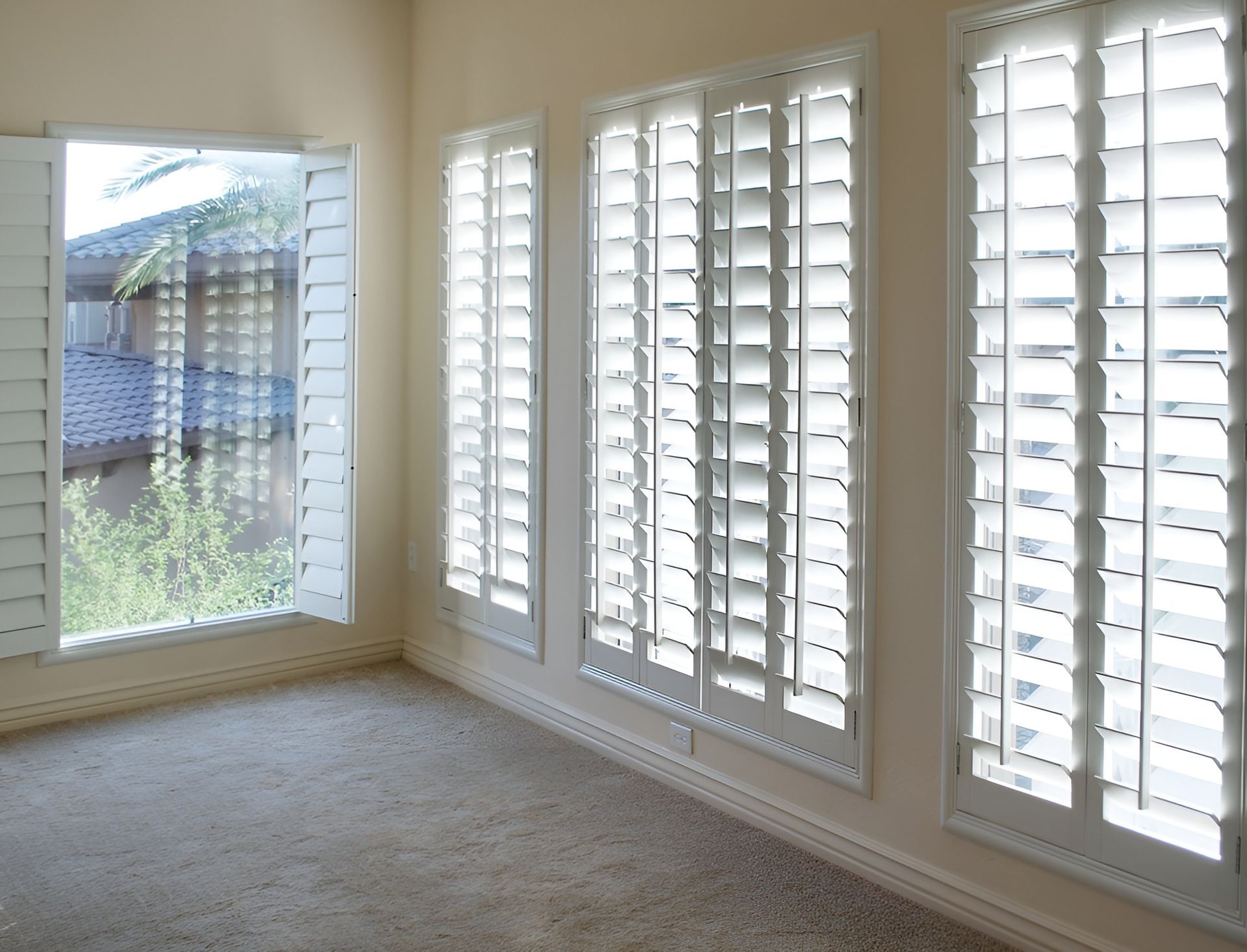 Empty Room with White Window Shutters, Beige Walls, and Tan Carpet — BlindDESIGN in Byron Bay, NSW
