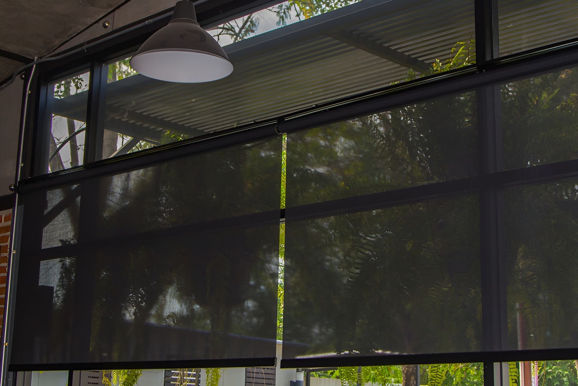 Black Roller Shades Partially Cover a Window — BlindDESIGN in Byron Bay, NSW