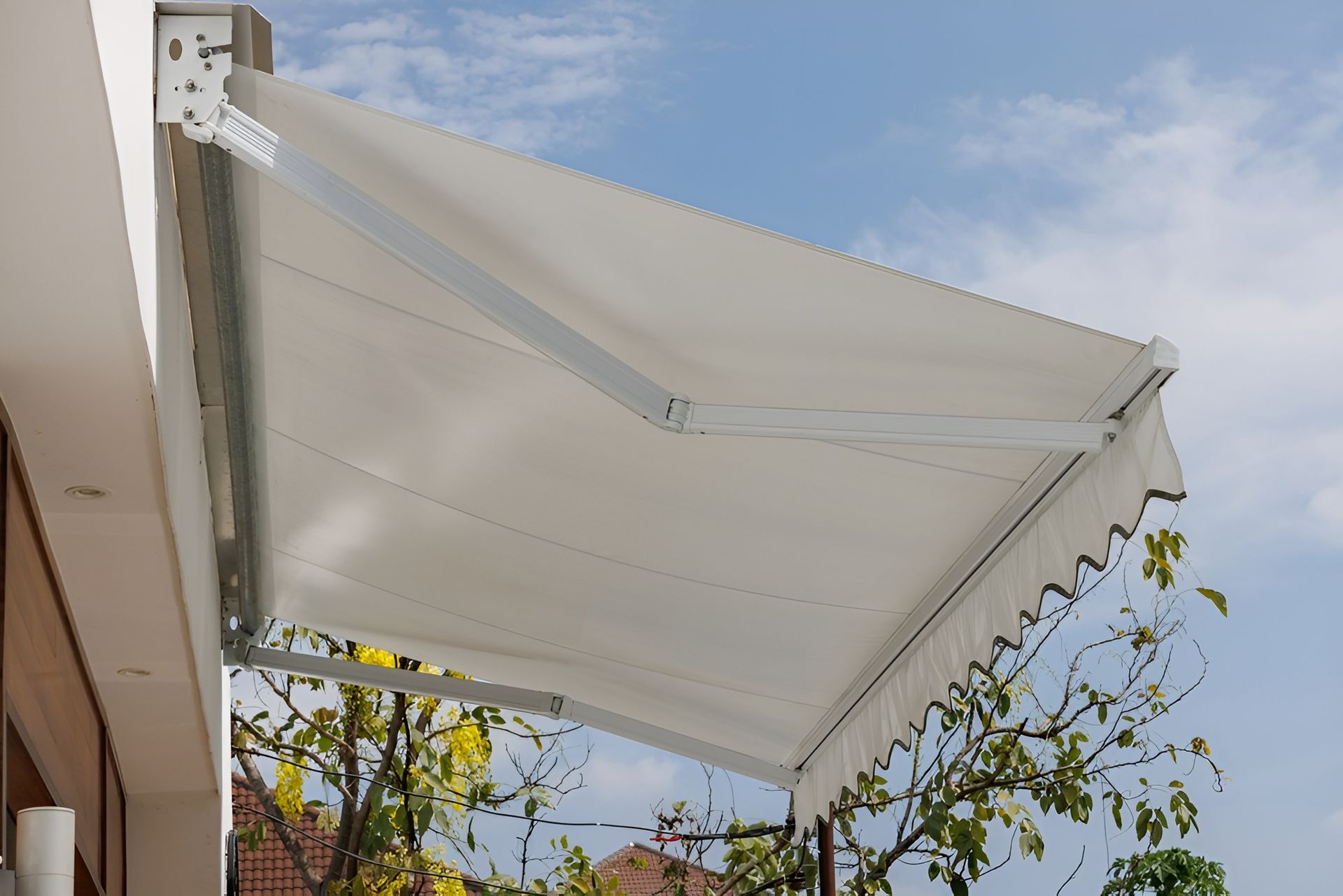 White Retractable Awning Extended from A Building, Against a Blue Sky — BlindDESIGN in Byron Bay, NSW