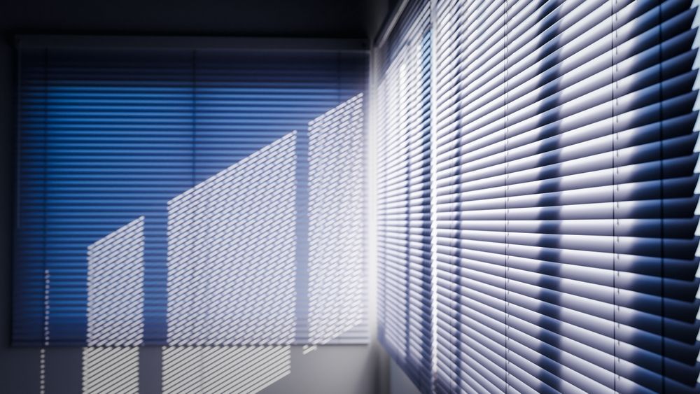 Shadows of Sunlight Filter Through Open Blinds on A Window — BlindDESIGN in Byron Bay, NSW