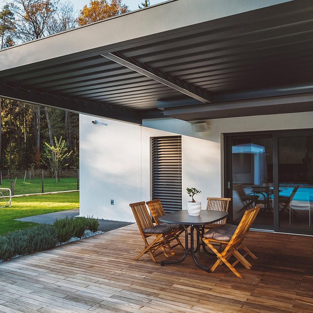 Patio With Seating Under a Gray Canopy, Adjacent to a House With Sliding Glass Doors — BlindDESIGN in Byron Bay, NSW