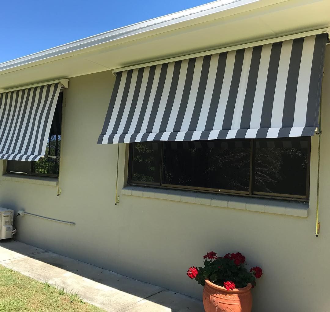 Gray and White Striped Awnings Over Windows of a Light Gray House — BlindDESIGN in Byron Bay, NSW