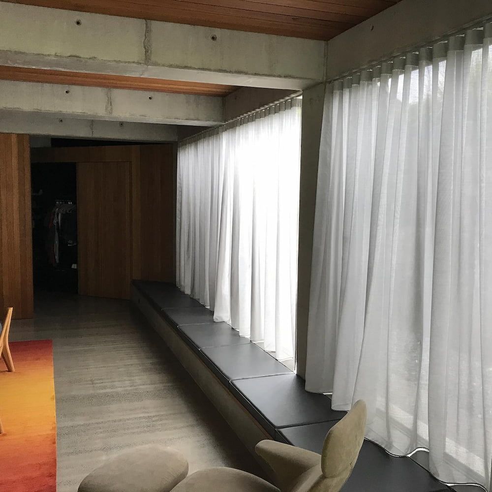 Interior With White Curtains, Concrete Beams, Window Seat, and Modern Furniture — BlindDESIGN in Lismore, NSW