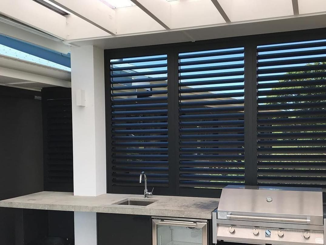 Outdoor Kitchen with Black Louvered Shutters — BlindDESIGN in Byron Bay, NSW