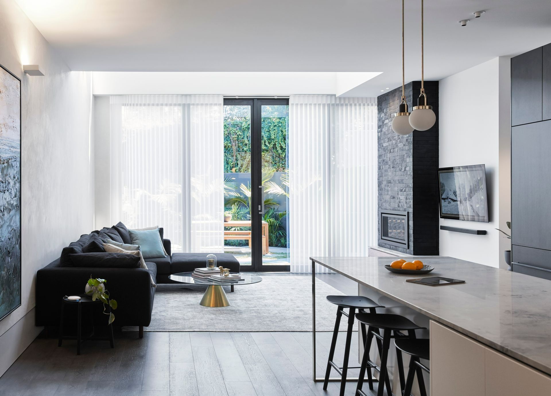 Modern Living Room with Black Sectional and White Blinds — BlindDESIGN in Byron Bay, NSW