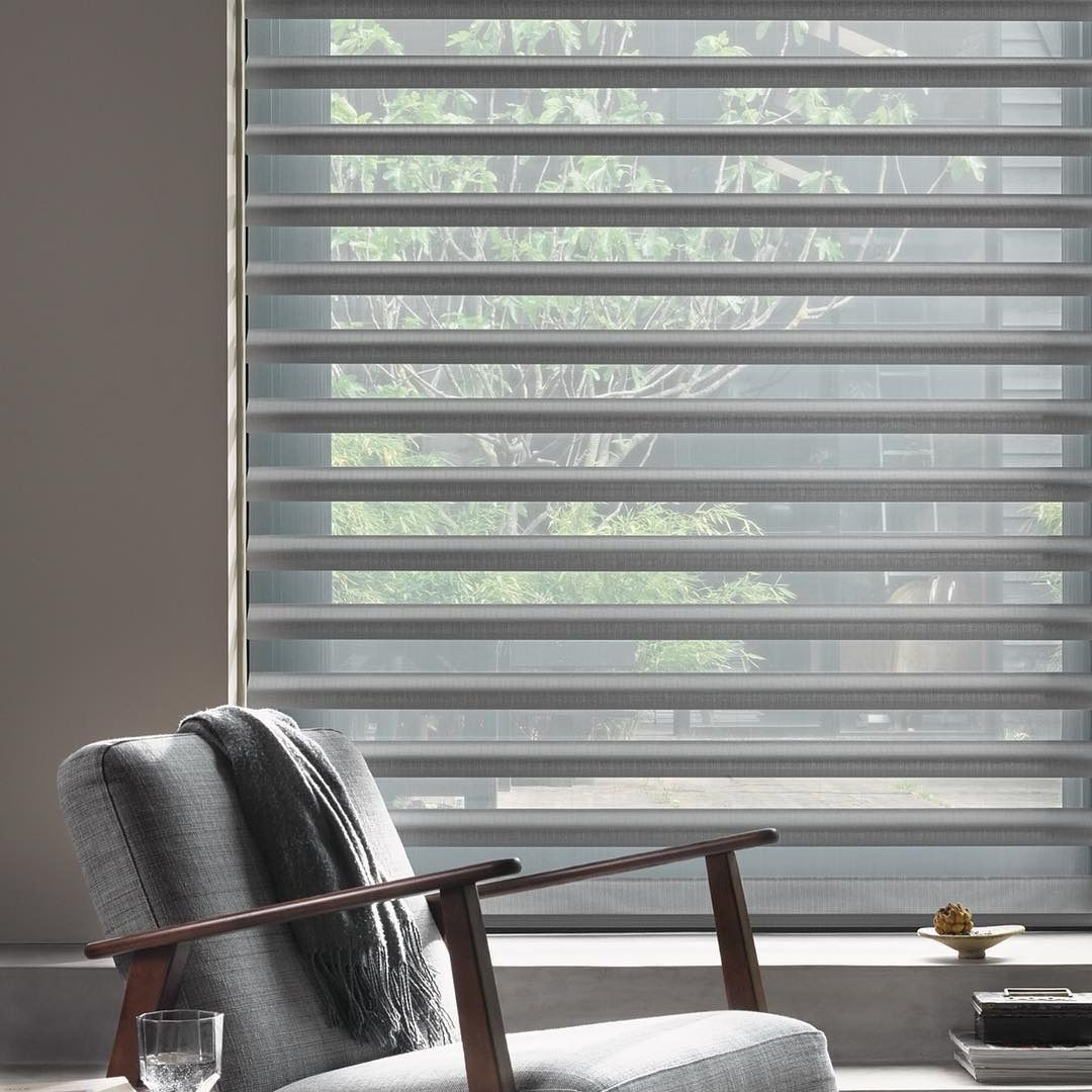 Modern Living Room with Light Gray Window Blinds and A Gray Armchair — BlindDESIGN in Byron Bay, NSW