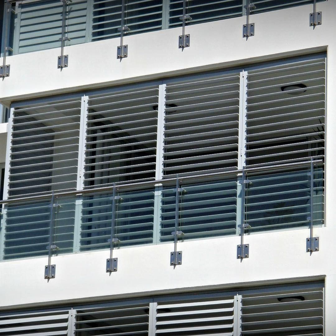 White Building with Multiple Floors, Each Having Horizontal, Slatted Sunshades — BlindDESIGN in Byron Bay, NSW