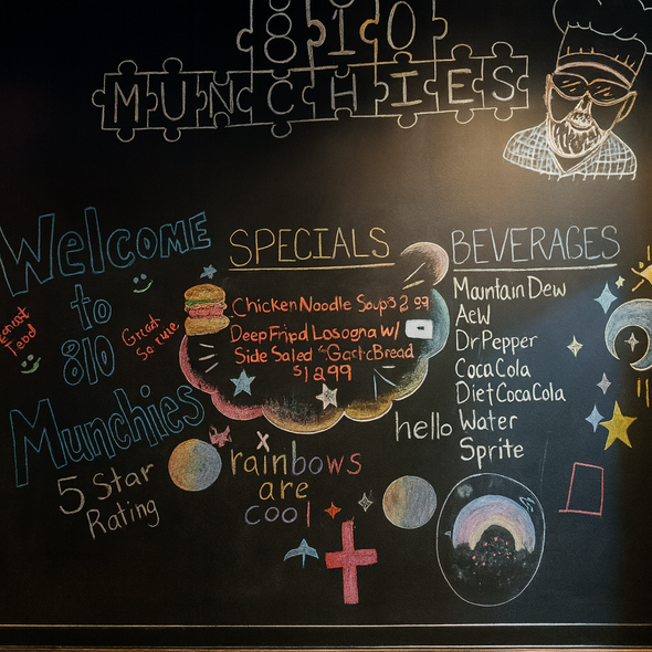 Blackboard menu with specials, drinks, and a welcome message at 